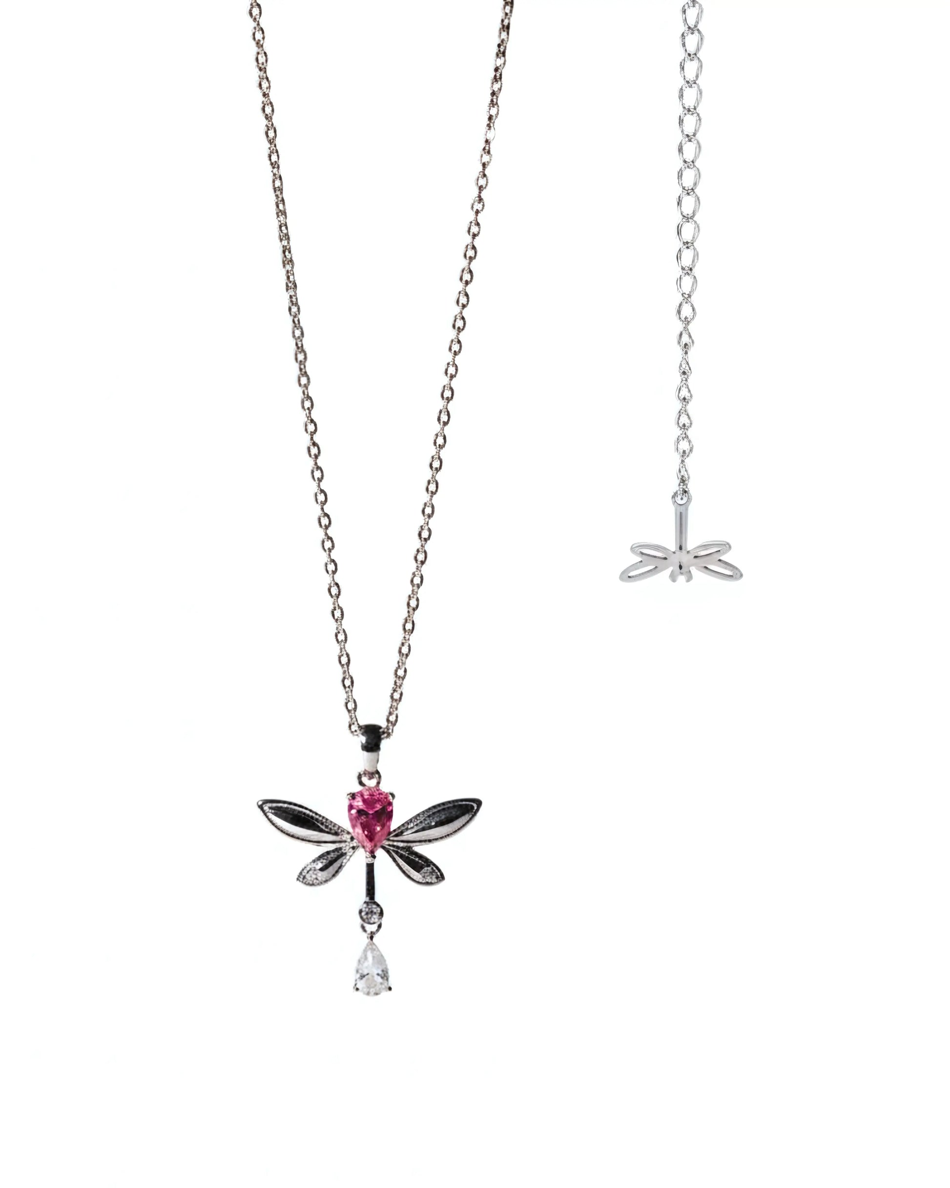Dragonfly-shaped necklace with pink gem and teardrop pendant on a white background