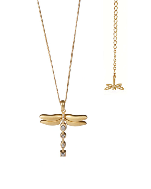 Gold dragonfly pendant necklace on a white background
