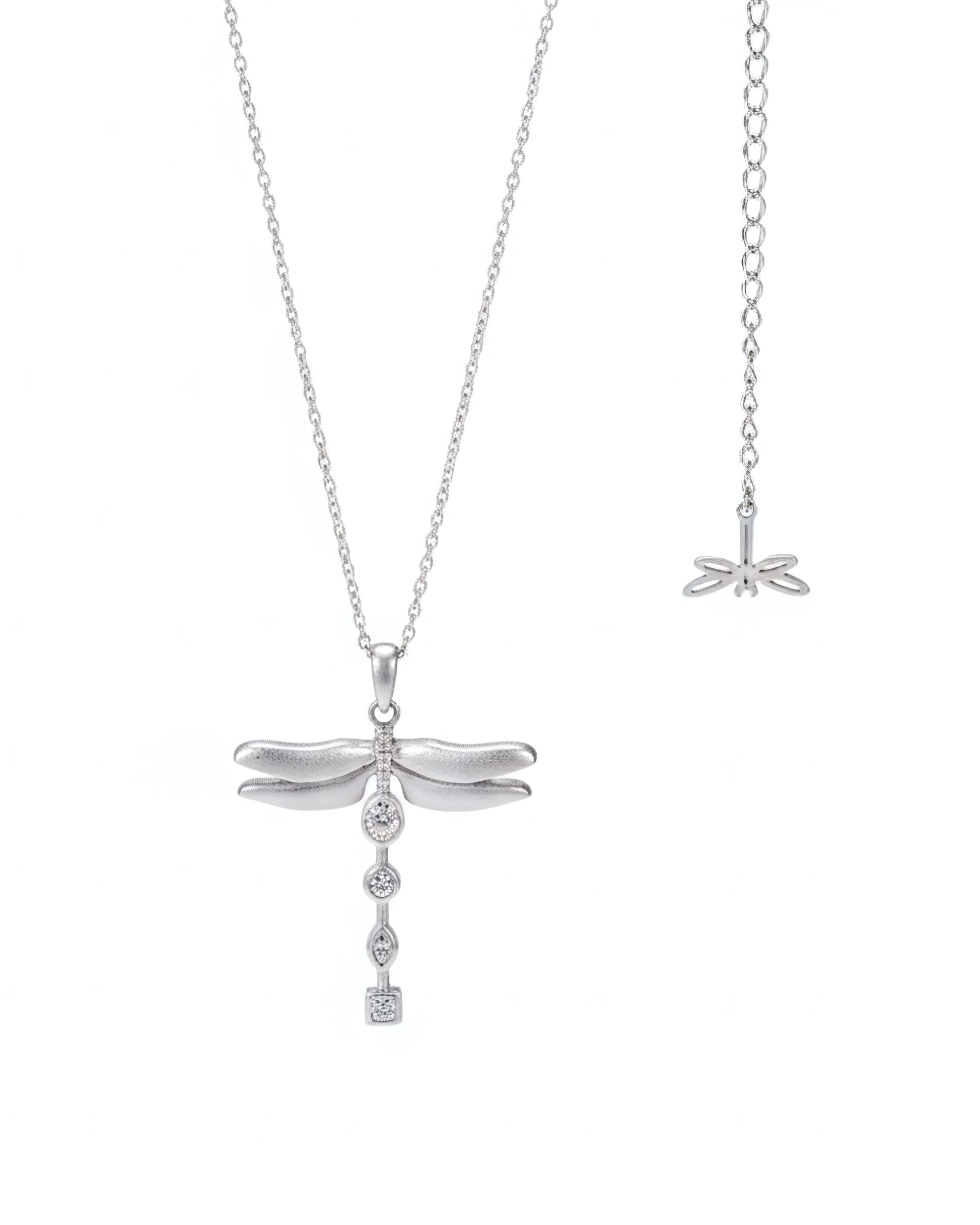 White gold dragonfly pendant necklace on a white background